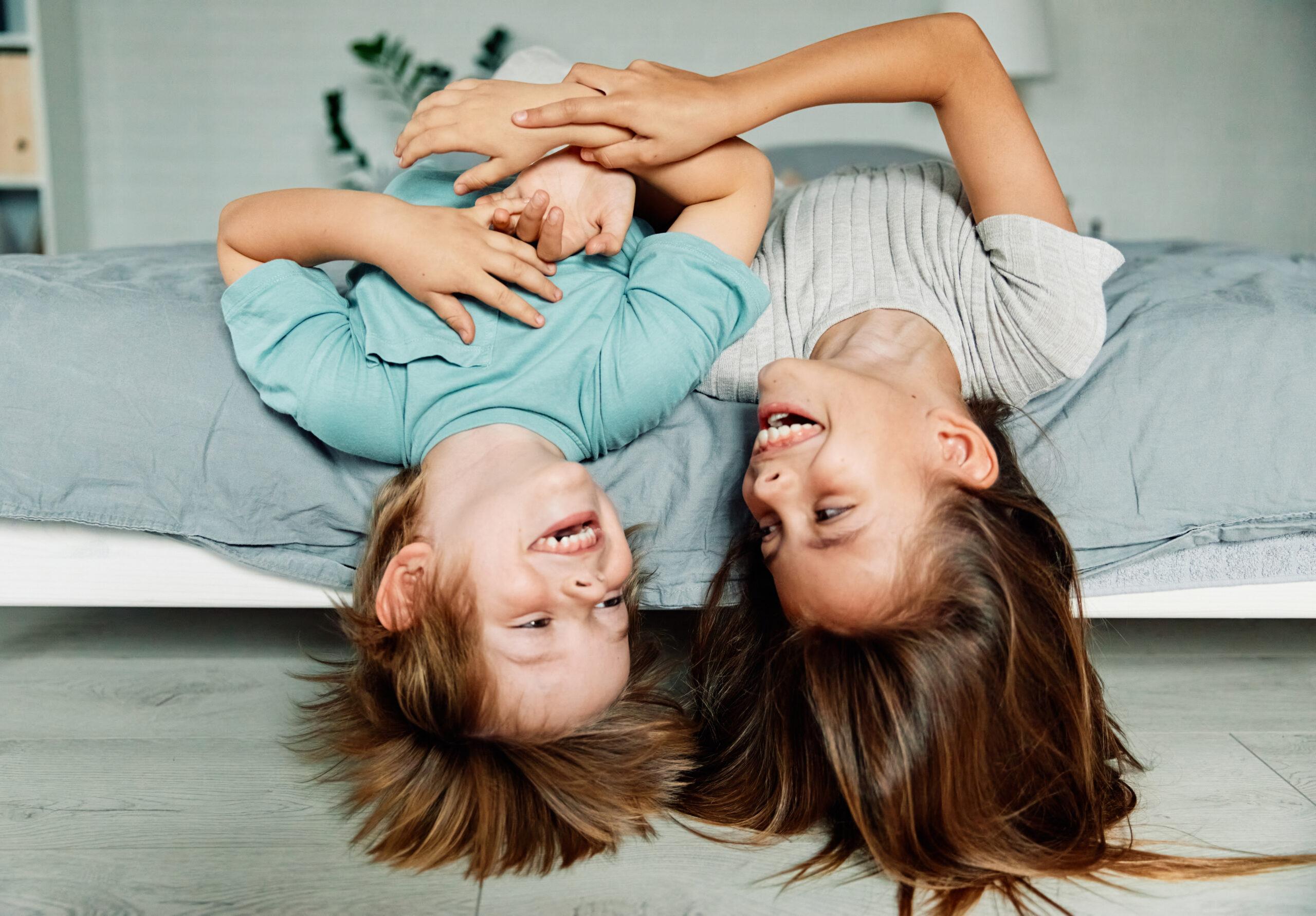 happy children in colorful painted bedroom